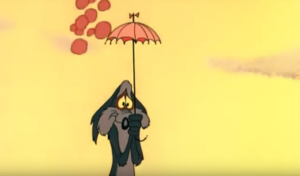 Coyote protegiéndose de una roca con un paraguas pequeño