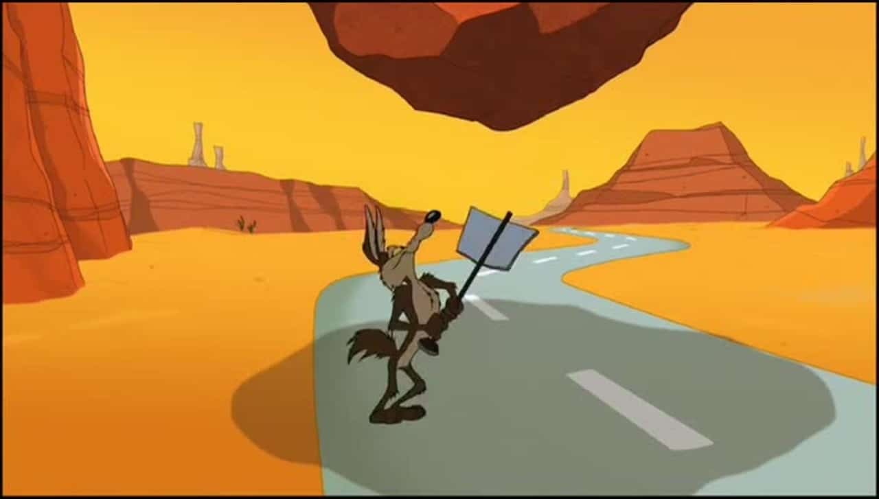 Coyote viendo como una roca le va a caer encima